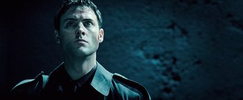 Movie still from “Underworld: Evolution” (2006), directed by Len Wiseman – A person wearing a jacket; Close Up shot, Low angle