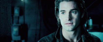 Movie still from “Underworld: Evolution” (2006), directed by Len Wiseman – A person with long hair; Close Up shot, Over the shoulder angle