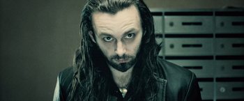 Movie still from “Underworld: Evolution” (2006), directed by Len Wiseman – A person with long hair and a beard; Close Up shot, High angle