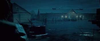 Movie still from “Underworld: Evolution” (2006), directed by Len Wiseman – A group of people walking in the dark outside; Extreme Wide shot, High angle