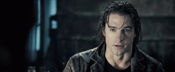 Movie still from “Underworld: Evolution” (2006), directed by Len Wiseman – A person with wet hair; Close Up shot, Over the shoulder angle