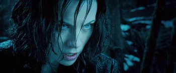 Movie still from “Underworld: Evolution” (2006), directed by Len Wiseman – A person with blue eyes; Close Up shot, Over the shoulder angle