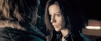 Movie still from “Underworld: Evolution” (2006), directed by Len Wiseman – A person wearing a leather jacket; Close Up shot, Over the shoulder angle
