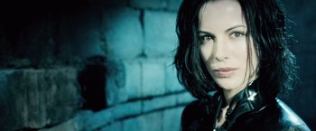 Movie still from “Underworld: Evolution” (2006), directed by Len Wiseman – A person wearing a black jacket; Close Up shot, Low angle