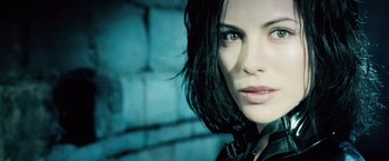 Movie still from “Underworld: Evolution” (2006), directed by Len Wiseman – A woman's face in front of a brick wall; Close Up shot, Low angle