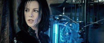 Movie still from “Underworld: Evolution” (2006), directed by Len Wiseman – A person wearing a black jacket; Close Up shot, Low angle