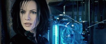 Movie still from “Underworld: Evolution” (2006), directed by Len Wiseman – A woman's face in front of a computer screen; Close Up shot, Over the shoulder angle