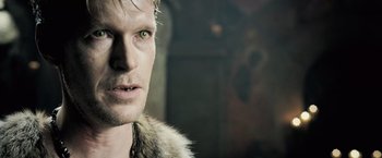 Movie still from “Underworld: Evolution” (2006), directed by Len Wiseman – A person wearing a fur coat; Close Up shot, Over the shoulder angle