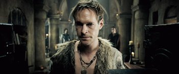 Movie still from “Underworld: Evolution” (2006), directed by Len Wiseman – A person wearing a fur coat; Close Up shot, Low angle