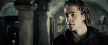 Movie still from “Underworld: Evolution” (2006), directed by Len Wiseman – A person wearing a sweater; Close Up shot, Over the shoulder angle