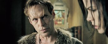 Movie still from “Underworld: Evolution” (2006), directed by Len Wiseman – A person wearing a fur coat; Close Up shot, Low angle