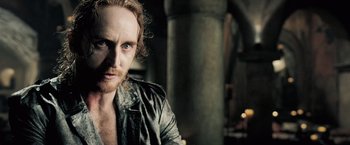 Movie still from “Underworld: Evolution” (2006), directed by Len Wiseman – A person wearing a jacket; Close Up shot, Over the shoulder angle