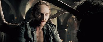 Movie still from “Underworld: Evolution” (2006), directed by Len Wiseman – A person wearing a shirt; Close Up shot, Over the shoulder angle