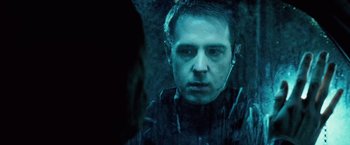 Movie still from “Underworld: Evolution” (2006), directed by Len Wiseman – A person wearing headphones; Close Up shot, Over the shoulder angle