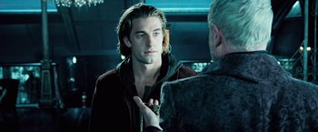 Movie still from “Underworld: Evolution” (2006), directed by Len Wiseman – A young man looking at a older man in a mirror; Close Up shot, Over the shoulder angle