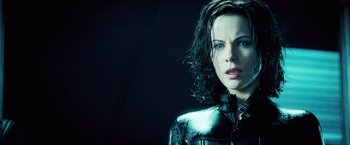 Movie still from “Underworld: Evolution” (2006), directed by Len Wiseman – A person wearing a jacket; Close Up shot, Over the shoulder angle