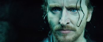 Movie still from “Underworld: Evolution” (2006), directed by Len Wiseman – A man's blue eyes and beard; Extreme Close Up shot, Over the shoulder angle