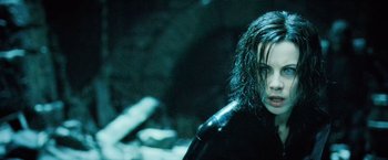 Movie still from “Underworld: Evolution” (2006), directed by Len Wiseman – A person wearing a wetsuit; Close Up shot, Low angle