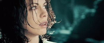 Movie still from “Underworld: Evolution” (2006), directed by Len Wiseman – A woman's face with long brown hair; Close Up shot, Low angle