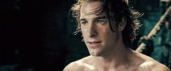Movie still from “Underworld: Evolution” (2006), directed by Len Wiseman – A person with wet hair; Close Up shot, Over the shoulder angle