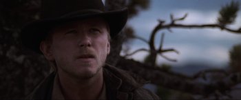Movie still from “Unforgiven” (1992), directed by Clint Eastwood – A person wearing a cowboy hat; Close Up shot, Low angle