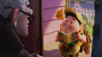 Movie still from “Up” (2009), directed by Bob Peterson – An image of an animated character reading a book; Medium shot, Over the shoulder angle