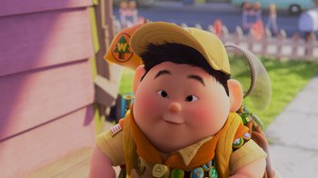 Movie still from “Up” (2009), directed by Bob Peterson – A boy scout doll wearing a hat; Close Up shot, Overhead angle