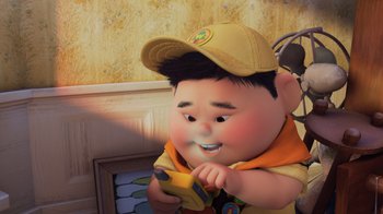Movie still from “Up” (2009), directed by Bob Peterson – An animated character is holding a banana in his hands; Medium shot, Overhead angle