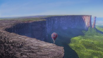 Movie still from “Up” (2009), directed by Bob Peterson – A balloon is flying over a cliff with a view of a valley; Extreme Wide shot, High angle