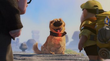 Movie still from “Up” (2009), directed by Bob Peterson – A dog sitting on the ground next to two other dogs; Wide shot, Over the shoulder angle