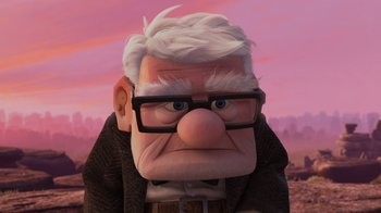 Movie still from “Up” (2009), directed by Bob Peterson – An old man wearing glasses and a jacket; Close Up shot, Low angle