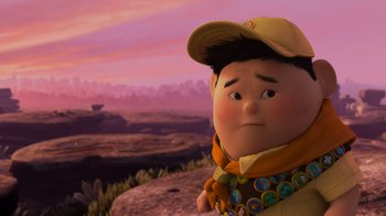 Movie still from “Up” (2009), directed by Bob Peterson – An image of an animated character in a field; Close Up shot, Over the shoulder angle