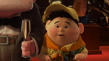 Movie still from “Up” (2009), directed by Bob Peterson – An image of an animated character with a glass of wine in his hand; Close Up shot, Over the shoulder angle