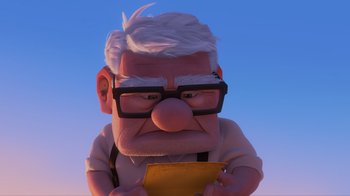 Movie still from “Up” (2009), directed by Bob Peterson – An old man with glasses is holding a piece of paper; Close Up shot, Low angle