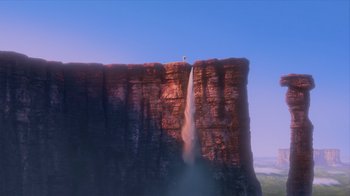 Movie still from “Up” (2009), directed by Bob Peterson – A bird sitting on top of a tall cliff; Extreme Wide shot, Low angle