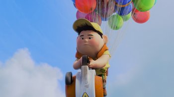Movie still from “Up” (2009), directed by Bob Peterson – An image of an animated character riding a car with balloons in the background; Wide shot, Low angle