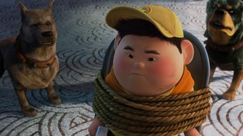 Movie still from “Up” (2009), directed by Bob Peterson – A cartoon of a boy wearing a hat and a rope around his neck; Close Up shot, Low angle
