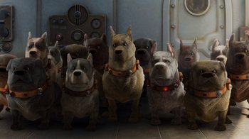 Movie still from “Up” (2009), directed by Bob Peterson – A group of dogs standing next to each other on the floor; Wide shot, High angle