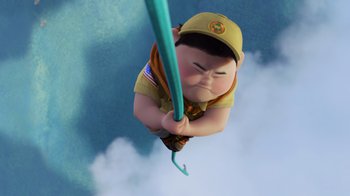 Movie still from “Up” (2009), directed by Bob Peterson – An image of a boy scout holding a pole in the sky; Medium shot, Overhead angle
