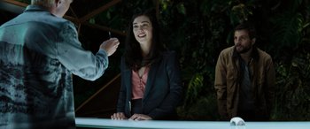 Movie still from “Upgrade” (2018), directed by Leigh Whannell – A woman in a black jacket is talking to a man; Medium shot, Over the shoulder angle