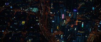 Movie still from “Upgrade” (2018), directed by Leigh Whannell – An aerial view of a busy city at night time; Extreme Wide shot, Overhead angle
