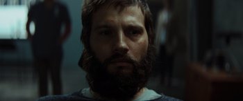 Movie still from “Upgrade” (2018), directed by Leigh Whannell – A person with a beard; Close Up shot, Low angle
