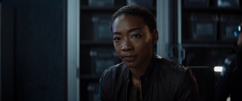 Movie still from “Upgrade” (2018), directed by Leigh Whannell – A person wearing a leather jacket; Close Up shot, Over the shoulder angle