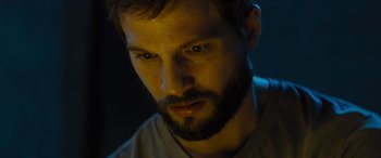 Movie still from “Upgrade” (2018), directed by Leigh Whannell – A person with a beard; Close Up shot, Low angle