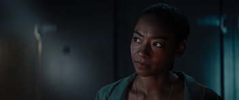 Movie still from “Upgrade” (2018), directed by Leigh Whannell – A person looking at the camera; Close Up shot, Over the shoulder angle