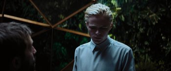 Movie still from “Upgrade” (2018), directed by Leigh Whannell – A man with blonde hair wearing a dress shirt and tie; Close Up shot, Low angle