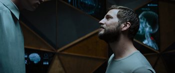 Movie still from “Upgrade” (2018), directed by Leigh Whannell – A man with a goatee looking up into the air; Close Up shot, Low angle