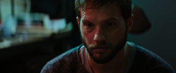 Movie still from “Upgrade” (2018), directed by Leigh Whannell – A person with a beard; Close Up shot, Over the shoulder angle