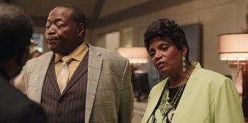 Movie still from “Vacation Friends” (2021), directed by Clay Tarver – A man and a woman standing next to each other; Close Up shot, Low angle