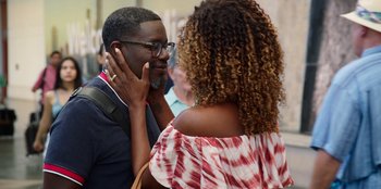 Movie still from “Vacation Friends 2” (2023), directed by Clay Tarver – A man and a woman are talking to each other; Close Up shot, Over the shoulder angle